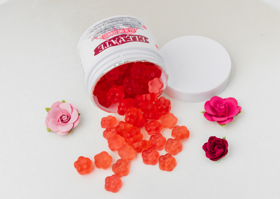 A jar of gummy bears and some roses